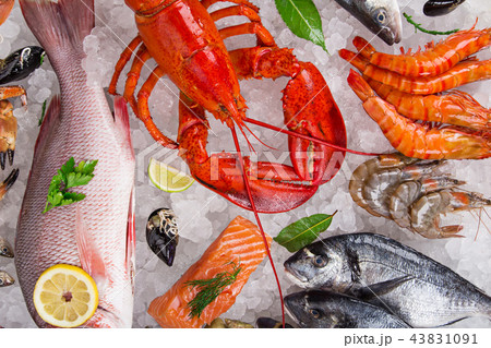 Fresh tasty seafood served on old wooden table. 43831091