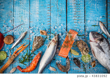 Fresh tasty seafood served on old wooden table. 43831092