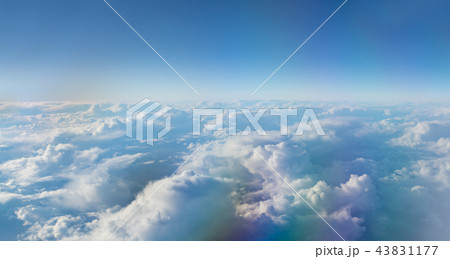 Beautiful sunset with cloudy sky from the airplane window. 43831177