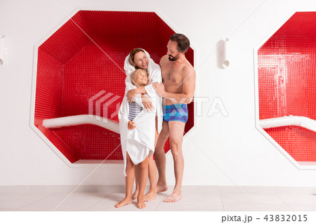 Delighted nice woman hugging her beautiful daughter Delighted nice woman hugging her beautiful daughter 43832015