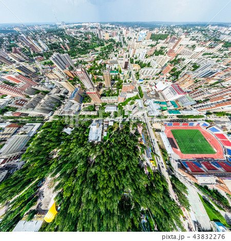 Aerial city view with crossroads and roads, houses, buildings, parks and parking lots. Sunny summer Aerial city view with crossroads and roads, houses, buildings, parks and parking lots. Sunny summer 43832276