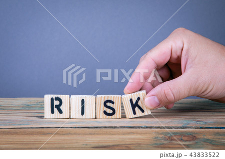 risk. Wooden letters on the office desk 43833522