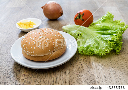 hamburger bun on dish and vegetable ,homemade 43833538