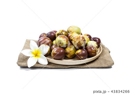 Chinese jujube on wood plate, isolated on white Chinese jujube on wood plate, isolated on white 43834266