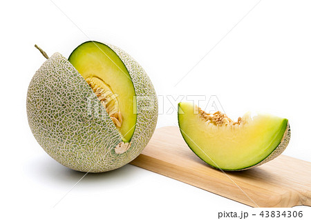 melon on cutting board isolated on white melon on cutting board isolated on white 43834306