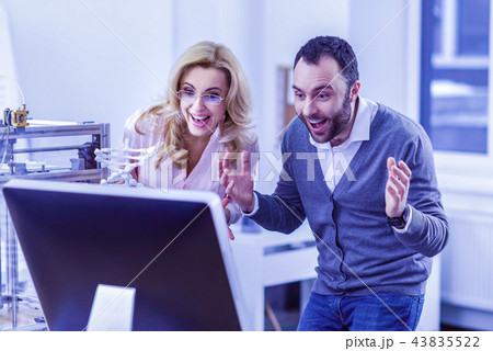 Joyful bearded man staring at screen of computer 43835522