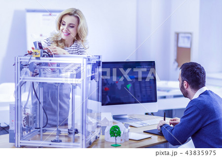 Positive delighted workers talking about their research 43835975