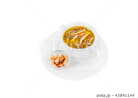 Soup in a white plate with croutons isolated white 43841144