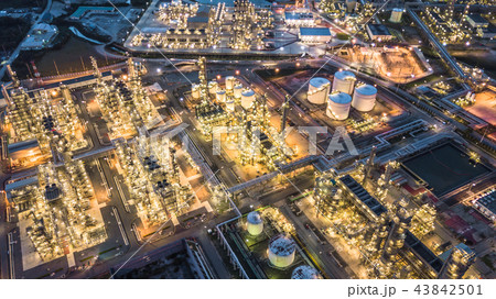 Aerial view oil and gas refinery plant at night. Aerial view oil and gas refinery plant at night. 43842501