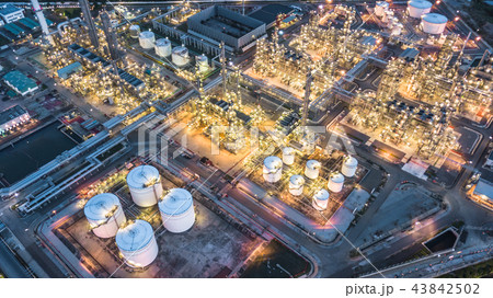 Aerial view oil and gas refinery plant at night. Aerial view oil and gas refinery plant at night. 43842502