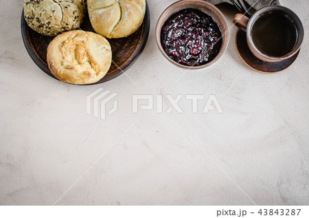 Breakfast: coffee americano, fresh buns and jam. 43843287