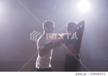 Active happy adults dancing bachata together in dance class 43846055