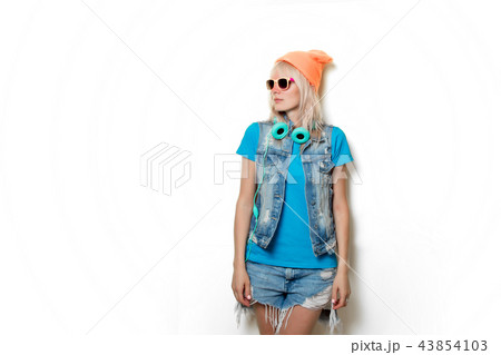 trendy girl in hat and headphones trendy girl in hat and headphones 43854103