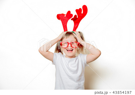 toddler girl in Christmas deer horns 43854197