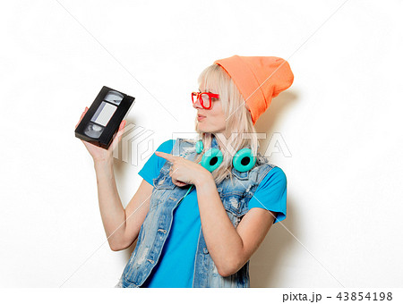 adult girl orange hat with VHS 43854198