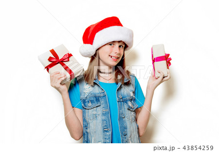 teenage girl in Christmas hat with gift box teenage girl in Christmas hat with gift box 43854259