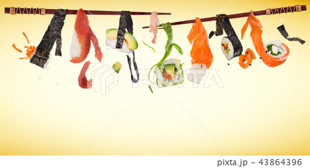 Pieces of delicious japanese sushi frozen in the air. Pieces of delicious japanese sushi frozen in the air. 43864396