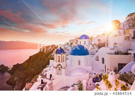 Sunset view of the blue dome churches of Santorini, Greece. Sunset view of the blue dome churches of Santorini, Greece. 43864514