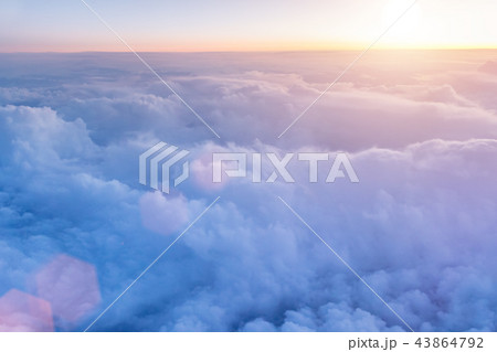 Beautiful sunset with cloudy sky from the airplane window. 43864792