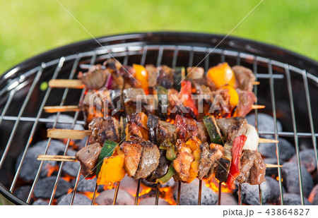 Barbecue grill with tasty skewers, close-up. Barbecue grill with tasty skewers, close-up. 43864827