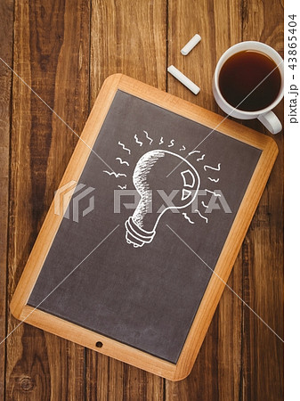 Light bulb on blackboard with coffee Light bulb on blackboard with coffee 43865404