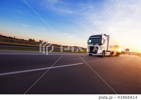 Loaded European truck on motorway in sunset 43866814