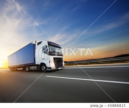 Loaded European truck on motorway in sunset 43866815