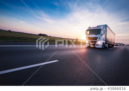 Loaded European truck on motorway in sunset 43866816