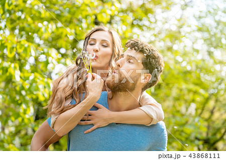 Woman and man on a meadow in romantic mood 43868111