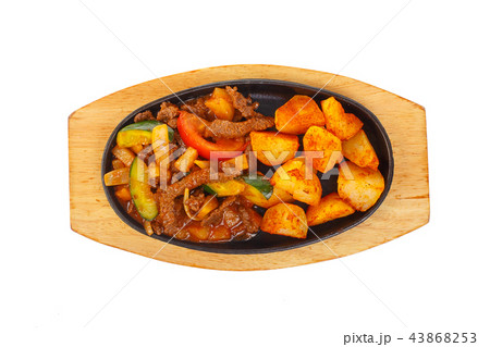 Potato with meat on frying pan isolated 43868253