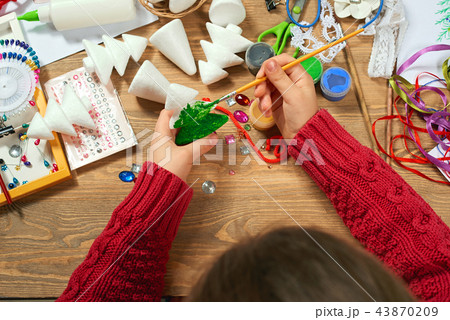 Childrens making decorations for new year holiday Childrens making decorations for new year holiday 43870209
