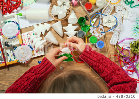 Childrens making decorations for new year holiday Childrens making decorations for new year holiday 43870210