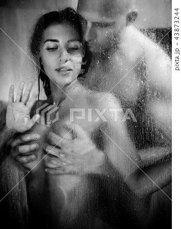 Young beautiful couple makes love in shower Young beautiful couple makes love in shower 43873244