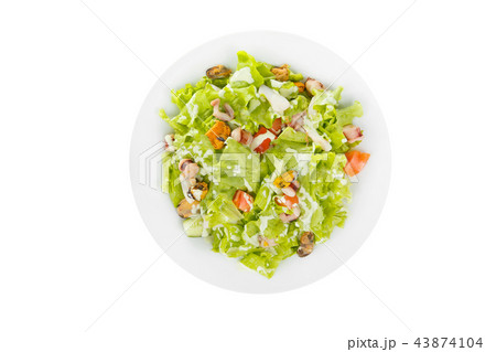 Salad with seafood on plate white isolated 43874104