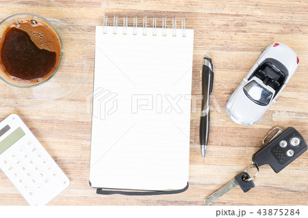 Toy car with notebook, calculator and coffee Toy car with notebook, calculator and coffee 43875284