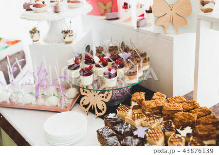 Different kinds of baked sweets on a buffet 43876139