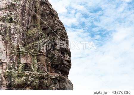 Face carved into stone of the ancient Bayan Temple at Angkor Wat, Cambodia. 43876886