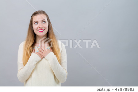 Woman with heartfelt expression 43878982