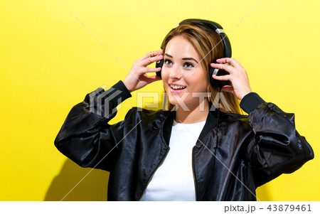 Happy young woman with headphones 43879461