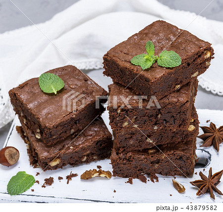 stack of baked square pieces of brownie pie 43879582