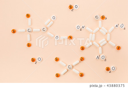 Several formulas of organic chemistry of their white and orange tablets and pills. 43880375