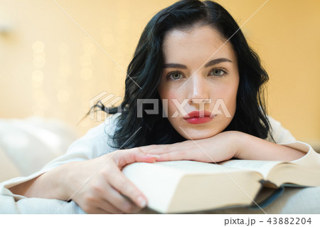 Young woman with a book Young woman with a book 43882204