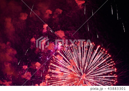 Very cheap firework over the city, red Very cheap firework over the city, red 43883301