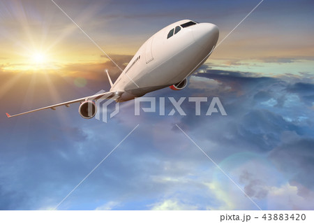 Commercial airplane flying above clouds. Commercial airplane flying above clouds. 43883420