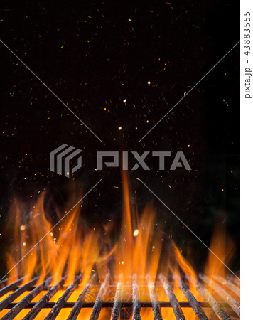Empty flaming charcoal grill with open fire. 43883555