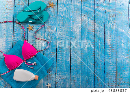 Summer beach accessory on the wood table. Summer beach accessory on the wood table. 43883837