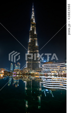 Dubai, United Arab Emirates - May 28 - Night view of Burj Khalifa - the highest building in the world - and lights reflection on the water. 43883988