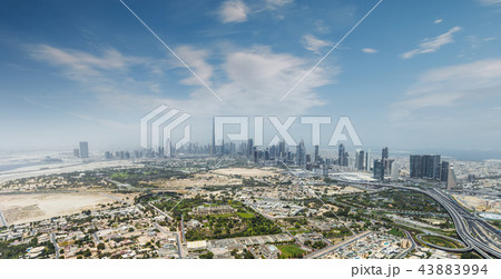 Aerial view of modern city skyscrapers in Dubai, UAE. 43883994