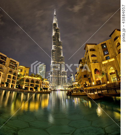 Dubai, United Arab Emirates - May 28, 2018 - Night view of Burj Khalifa - the highest building in the world - and lights reflection on the water in Palace Downtown hotel. 43884057