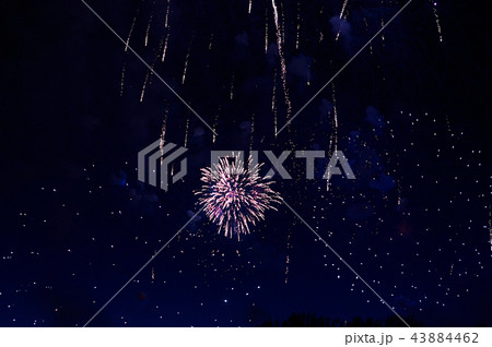 Very cheap firework over the city, red and blue Very cheap firework over the city, red and blue 43884462